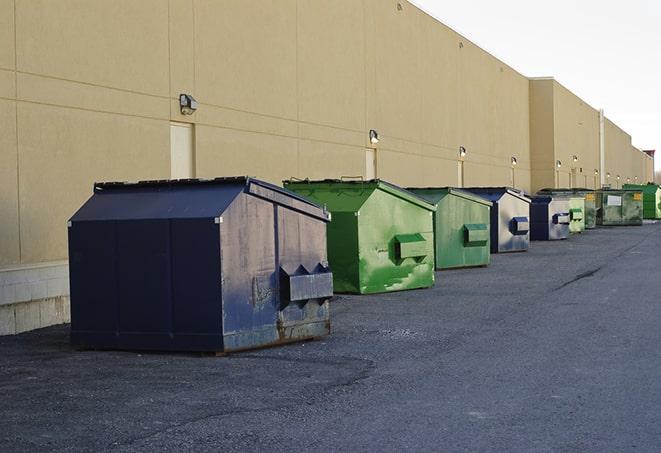 large construction dumpster positioned on a city street in Brookdale, CA